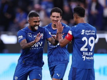 احتفال سالم الدوسري وداروين نونيز ومالكوم مهاجمو الهلال بتسجيل هدف في مرمى الرياض بدوري روشن السعودي - 29 أغسطس 2025 - Reuters