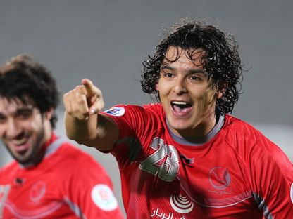 سيباستيان سوريا لاعب لخويا السابق يحتفل بهدفه أمام الاتحاد السعودي بدوري أبطال آسيا - 18 مارس 2014 - Reuters