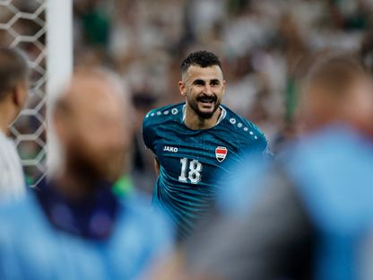 أيمن حسين يحتفل بتسجيله هدفاً للعراق في مرمى بوليفيا بنهائي الملحق العالمي المؤهل لكأس العالم - 31 مارس 2026 - REUTERS