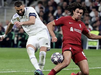 كريم بنزيما وأرنولد في مباراة ريال مدريد وليفربول إياب دوري أبطال أوروبا 2023 - ٍReuters