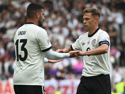 قائد ألمانيا جوشوا كيميتش ودنيس أونداف أمام فرنسا في مباراة تحديد المركز الثالث بدوري الأمم الأوروبية - 8 يونيو 2025 - uefa.com