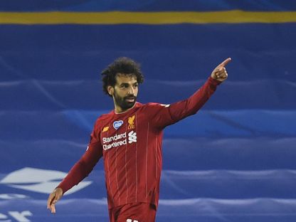 النجم المصري لـ"ليفربول" محمد صلاح يحتفل بتسجيله هدفاً في شباك "برايتون" - AFP