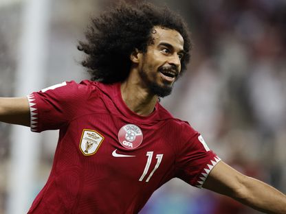 أكرم عفيف لاعب قطر يحتفل بعد تسجيل هدفٍ في شباك لبنان - 12 يناير 2024 - REUTERS