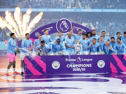 من احتفالات مانشستر سيتي بلقب الدوري الإنجليزي الممتاز في الموسم الماضي - Pool via REUTERS