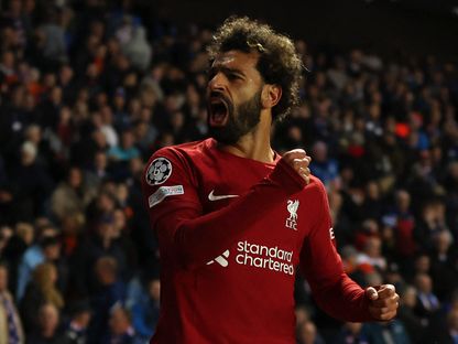 محمد صلاح يحتفل بعد تسجيل الهدف السادس لليفربول في شباك رينجرز الاسكتلندي - 12 أكتوبر 2022 - Action Images via Reuters