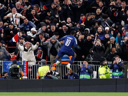 عثمان ديمبيلي لاعب باريس سان جيرمان يحتفل بعد التسجيل بمواجهة ليفربول في إياب ثمن نهائي دوري أبطال أوروبا - 11 مارس 2025 - Reuters