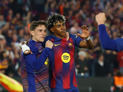 جافي ولامين يامال يحتفلان بعد فوز برشلونة على إسبانيول - 11 أبريل 2026 - REUTERS