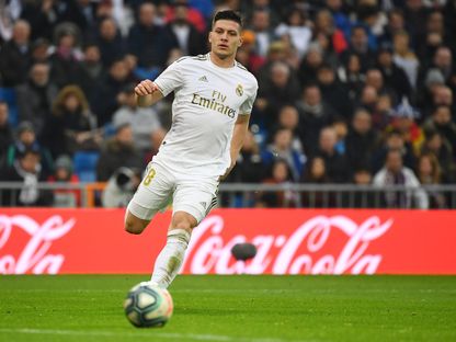 مهاجم ريال مدريد، لوكا يوفيتش، خلال مباراة بين ريال مدريد وإشبيلية بالدوري الإسباني - AFP