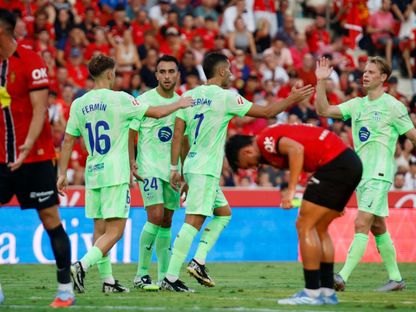 لاعبو ريال مايوركا في حسرة بعد تلقيهم لهدفين أمام برشلونة في الليغا 16-8-2025 - Reuters