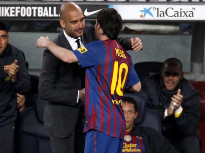 ميسي وغوارديولا خلال تواجدهما معاً في نادي برشلونة -5 مايو 2023 - reuters
