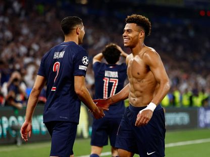 ديزيري دوي (يمين) وأشرف حكيمي يحتفلان بالتسجيل ضد إنتر في نهائي أبطال أوروبا - 31 مايو 2025 - Reuters