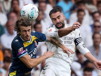 داني كارفاخال وكارلوس روميرو في مباراة ريال مدريد وإسبانيول بالدوري الإسباني 20 سبتمبر 2025 - Reuters