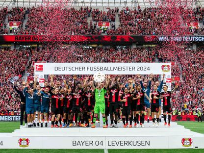 لاعبو باير ليفركوزن يحتفلون بلقب الدوري الألماني- 18 مايو 2024 - X/@bayer04fussball