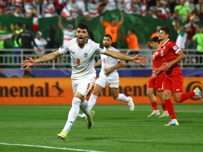 مهدي طارمي لاعب منتخب إيران يحتفل بعد التسجيل في مرمى سوريا - 31 يناير 2024 - REUTERS