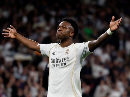 فينيسيوس جونيور يحتفل بهدفه في مباراة ريال مدريد وأتلتيكو مدريد بالدوري الإسباني - 22 مارس 2026 - Reuters