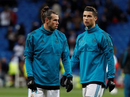 غاري ثبيل وكريستيانو رونالدو خلال الإحامء قبل مباراة ريال مدريد ويوفنتوس في دوري أبطال أوروبا - 11 أبريل 2018 - REUTERS