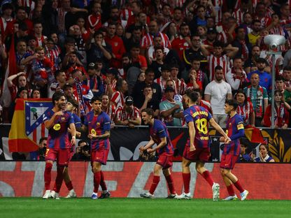 احتفال لاعبي برشلونة بهدف فيران توريس ضد أتلتيكو مدريد بدوري أبطال أوروبا - 14 أبريل 2026 - Reuters