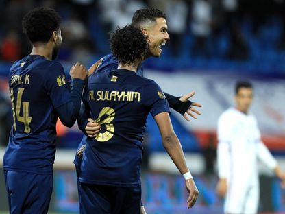 عبد المجيد الصليهم لاعب النصر يحتفل مع كريستيانو رونالدو بهدف ضد أبها - 2 أبريل 2024 - Reuters