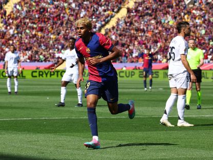 لامين يامال يحتفل بعد تسجيله هدفاً لبرشلونة في شباك ريال مدريد - 11 مايو 2025 - REUTERS