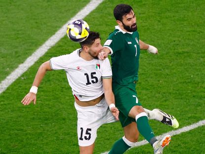 عمر خربين في صراع مع ميشيل تيرمانيني خلال مباراة سوريا وفلسطين بكأس العرب - 7 ديسمبر 2025 - Reuters