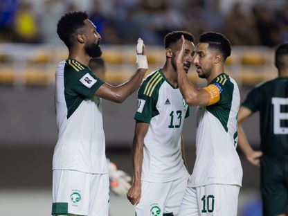 لاعبو المنتخب السعودية يحتفلون بعد التسجيل بمواجهة باكستان في التصفيات الآسيوية المشتركة - 6 يونيو 2024 - X/@SaudiNT