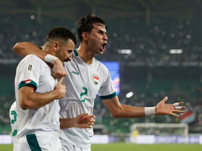 احتفال إبراهيم بايش وأيمن حسين لاعبي العراق بتسجيل هدف في مرمى فلسطين بتصفيات كأس العالم 2026 - 10 أكتوبر 2024 - Reuters