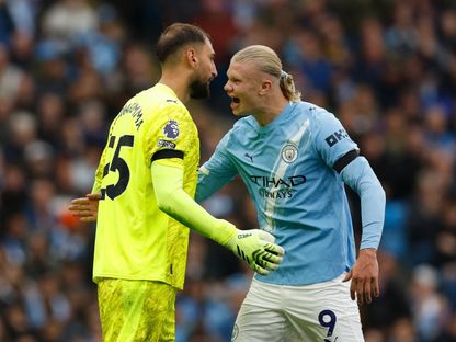 إيرلينغ هالاند وجيانلويجي دوناروما خلال مباراة بين مانشستر سيتي ومانشستر يونايتد بالدوري الإنجليزي الممتاز - 14 سبتمبر 2025 - Reuters