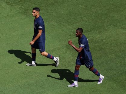 عثمان ديمبيلي وأشرف حكيمي من مباراة باريس سان جيرمان وريال مدريد بكأس العالم للأندية - 9 يوليو 2025 - Reuters
