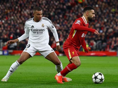 محمد صلاح وكيليان مبابي نجما ليفربول وريال مدريد خلال مواجهتهما بدوري أبطال أوروبا - 27 نوفمبر 2024 - Reuters