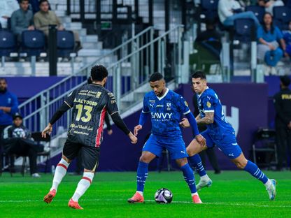 مالكوم وجواو كانسيلو خلال مباراة بين الهلال والرائد في الدوري السعودي - 7 ديسمبر 2024 - X/@Alhilal_EN