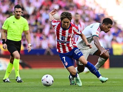 لي كانغ إن وجود بيلينغهام خلال مباراة أتلتيكو مدريد وريال مدريد بالدوري الإسباني - 21 سبتمبر 2026 - Reuters