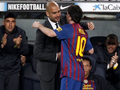 ميسي وغوارديولا خلال تواجدهما معاً في نادي برشلونة -5 مايو 2023 - reuters