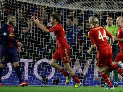 لاعبو بايرن ميونيخ يحتفلون بهدف مولر في مرمى برشلونة في إياب نصف نهائي دوري أبطال أوروبا - 1 مايو 2013 - Reuters