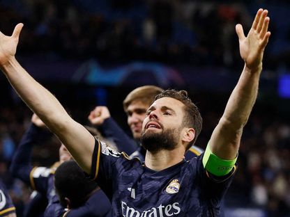 ناتشو فيرنانديز سعيد بفوز ريال مدريد على مانشستر سيتي في دوري أبطال أوروبا 17-4-2024 - Reuters