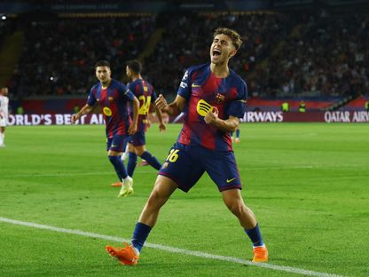 فيرمين لوبيز لاعب برشلونة يحتفل بعد تسجيله الهدف الخامس لفريقه في شباك أولمبياكوس في دوري أبطال أوروبا - 21 سبتمبر 2025 - REUTERS