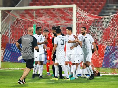 لاعبو منتخب فلسطين يحتفلون بعد التسجيل أمام البحرين - 25 مارس 2023 - FACEBOOK/PalestineFootballAssociation