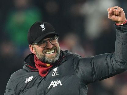 مدرب ليفربول الألماني يورغن كلوب يحتفل بعد الفوز في إحدى المباريات - AFP