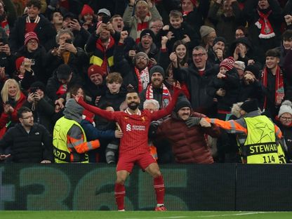 محمد صلاح نجم ليفربول يحتفل بهدفه أمام ليل بدوري أبطال أوروبا - 21 يناير 2025 - Reuters