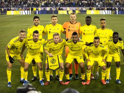 صورة جماعية للاعبي فريق ناشفيل النشط في دوري كرة القدم للمحترفين بالولايات المتحدة الأميركية - AFP