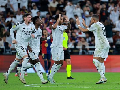 رودريغو يحتفل بهدفه مع ريال مدريد أمام برشلونة في السوبر الإسباني في جدة مع كيليان مبابي وفينيسيوس جونيور وفيديريكو فالفيردي - 12 يناير 2025 - Reuters