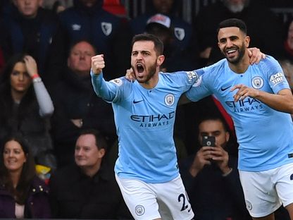 رياض محرز لاعب مانشستر سيتي يحتفل مع زميله برناردو سيلفا بعد التسجيل أمام بورنموث - 2 مارس 2019 - REUTERS