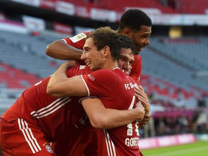 لاعبو بايرن ميونيخ يحتلفون بهدف الفوز على بوروسيا مونشنغلادباخ - AFP