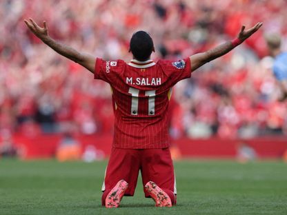 محمد صلاح يحتفل بلقبه الثاني في الدوري الإنجليزي الممتاز والتاسع مع ليفربول 27-4-2025 - Reuters