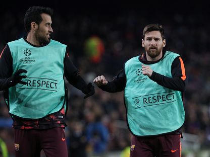 ميسي وبوسكيتس عندما كانا لاعبين معاً في نادي برشلونة - 6 ديسمبر 2017 - reuters 