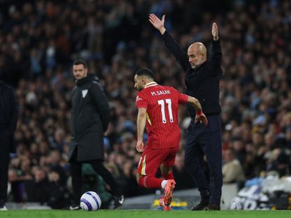 محمد صلاح لاعب ليفربول وبيب غوارديولا مدرب مانشستر سيتي - 23 فبراير 2025 - Reuters