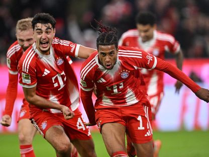 مايكل أوليس مهاجم بايرن يحتفل بهدفه في مرمى بوروسيا دورتموند - 18 أكتوبر 2025 - Reuters