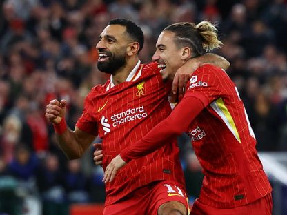 لاعب ليفربول محمد صلاح يحتفل بالتسجيل مع كوستاس تسيميكاس ضد بولونيا بدوري أبطال أوروبا - 2 أكتوبر 2024 - Reuters