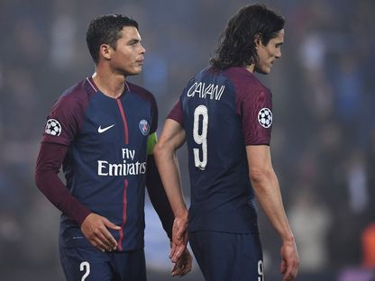 مهاجم باريس سان جيرمان الأورغواياني إدينسون كافاني والمدافع البرازيلي تياغو سيلفا - AFP