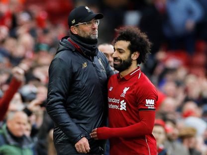 لاعب ليفربول المصري محمد صلاح ومدرب الفريق يورغن كلوب - 14 أبريل 2019 - REUTERS