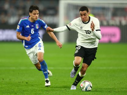 صامويل ريتشي في مواجهة جمال موسيالا بمواجهة إيطاليا وألمانيا ضمن دوري الأمم الأوروبية - 23 مارس 2025 - Reuters